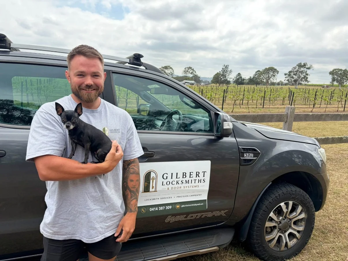 Josh Gilbert with his branded locksmith truck